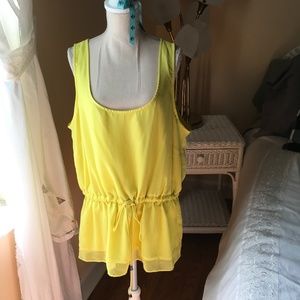 Electric yellow poly blouse with elastic ties at waist. Lined.